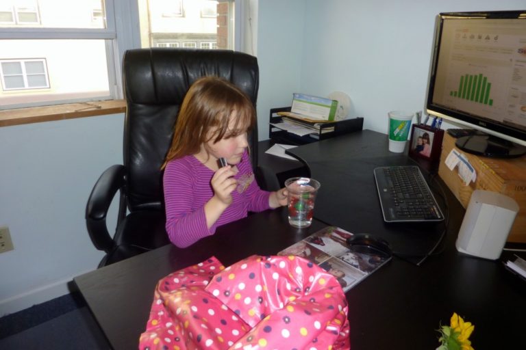 Young girl sitting at computer